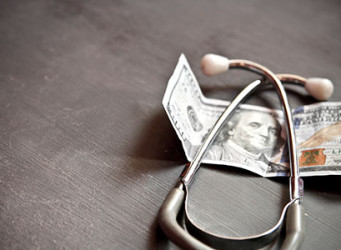 Stethoscope Next to 100 Dollar Bill